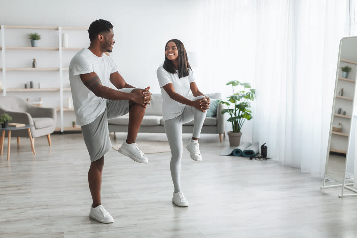couple-practicing-knee-mobility-exercises-at-home