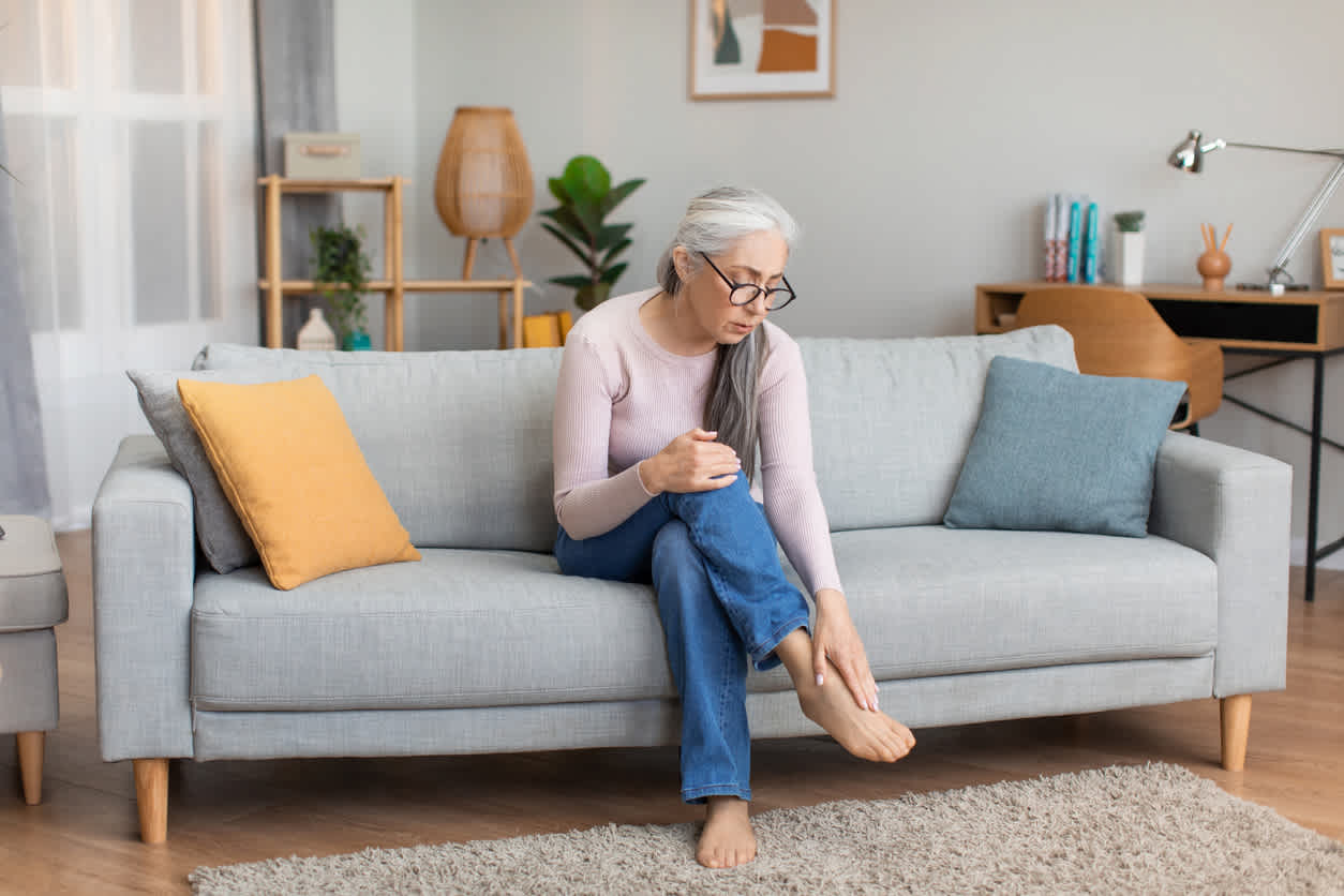 elderly-woman-touching-feet