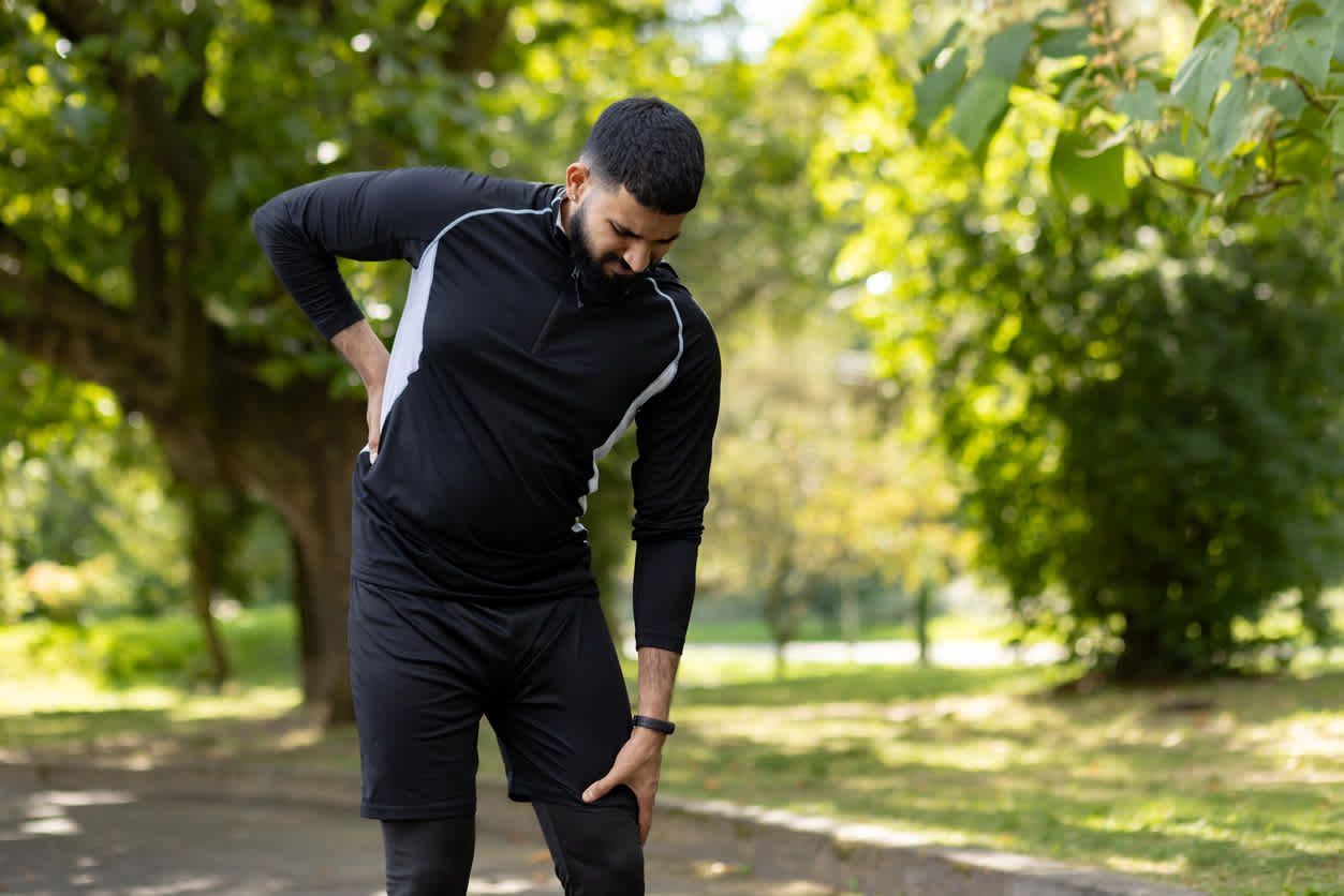 man-experiencing-back-pain-due-to-tight-hamstrings