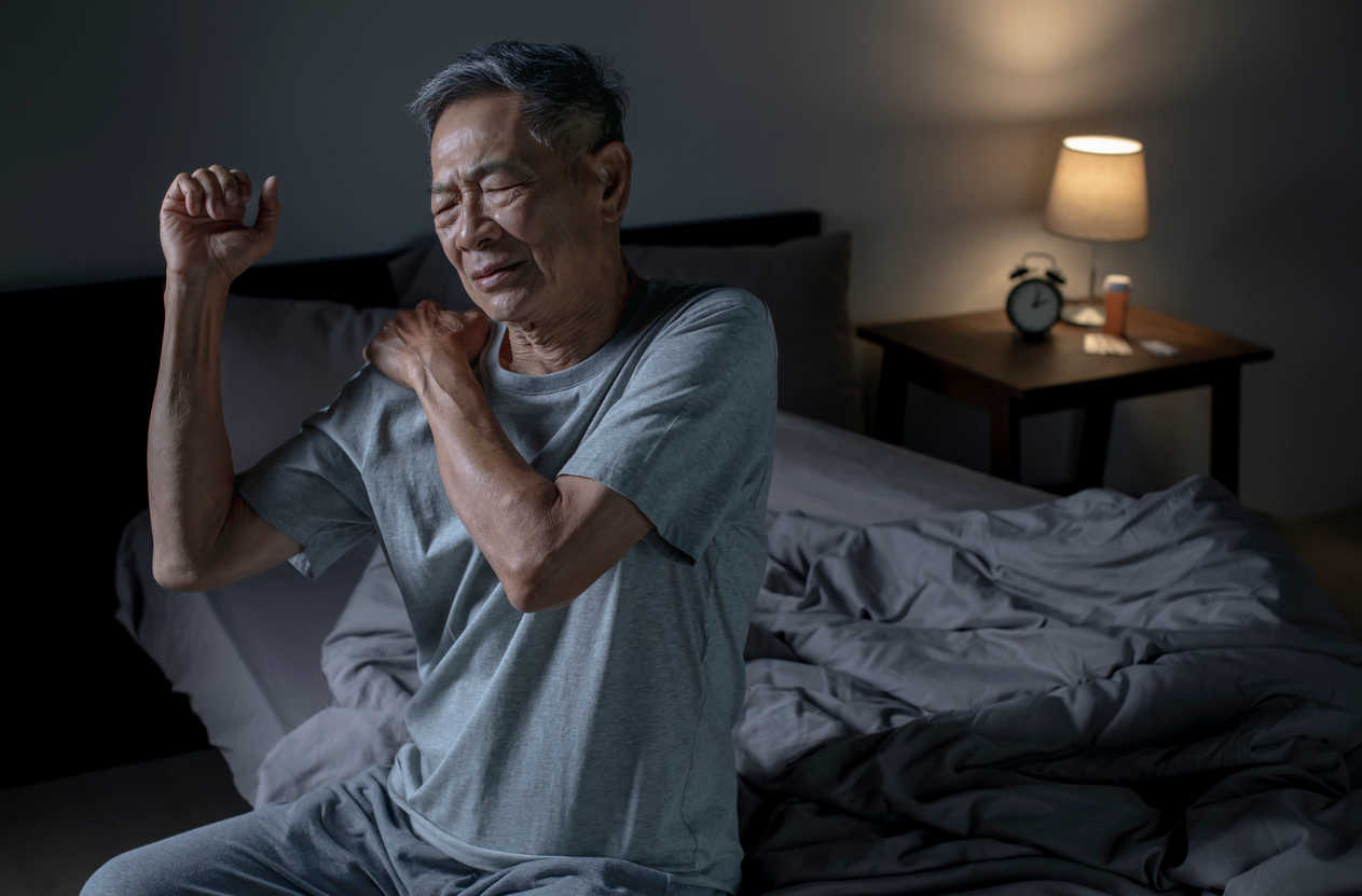 man-thinking-how-to-relieve-rotator-cuff-pain-at-night