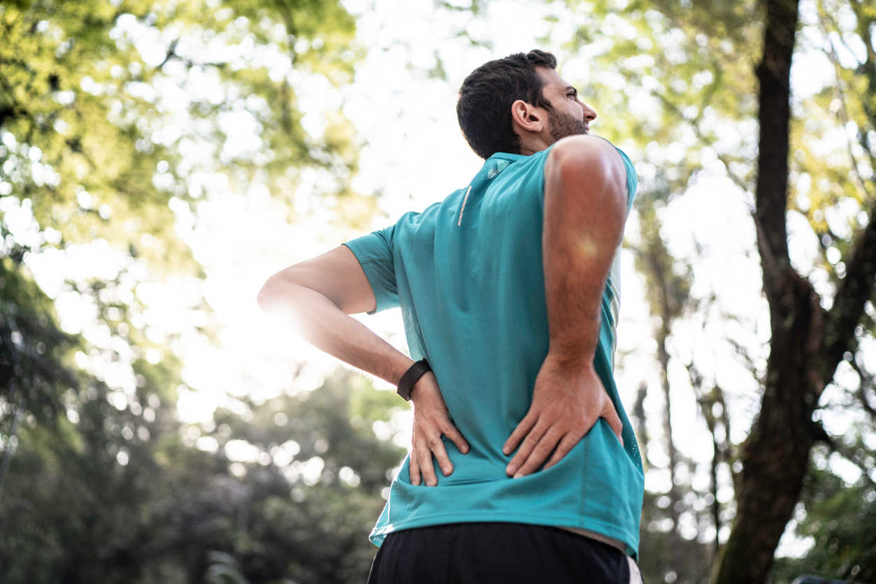 man-feeling-lower-back-pain-after-workout