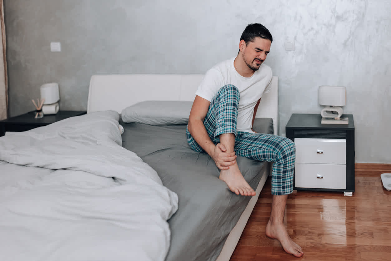 man-in-bed-with-ankle-pain