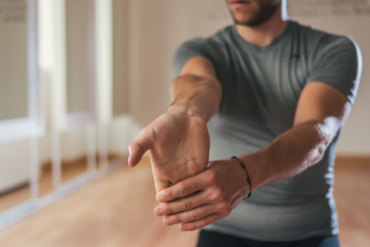 man-stretching-his-fingers