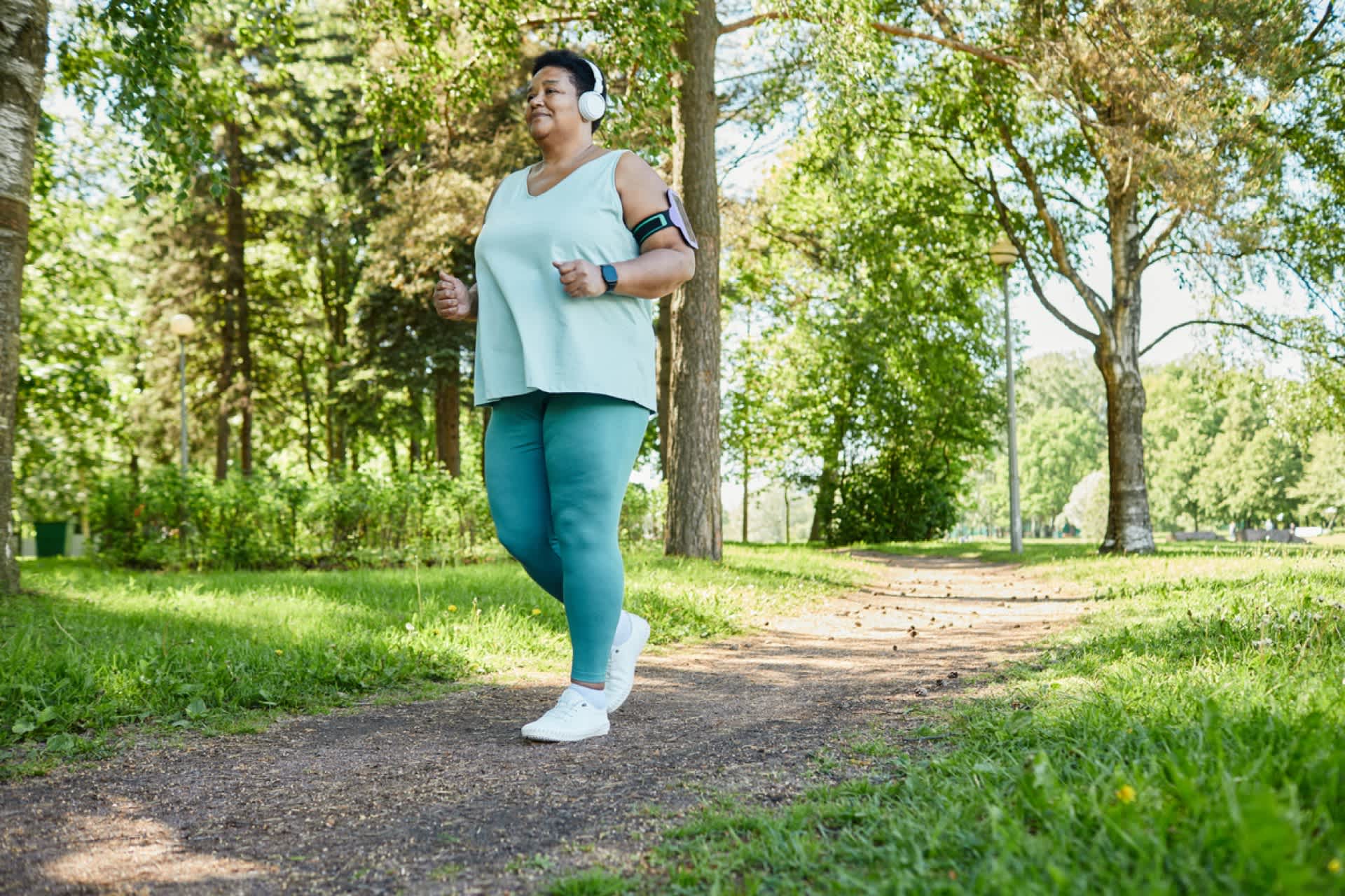 Older-woman-taking-a-walk-at-a-park-what-is-brisk-walking