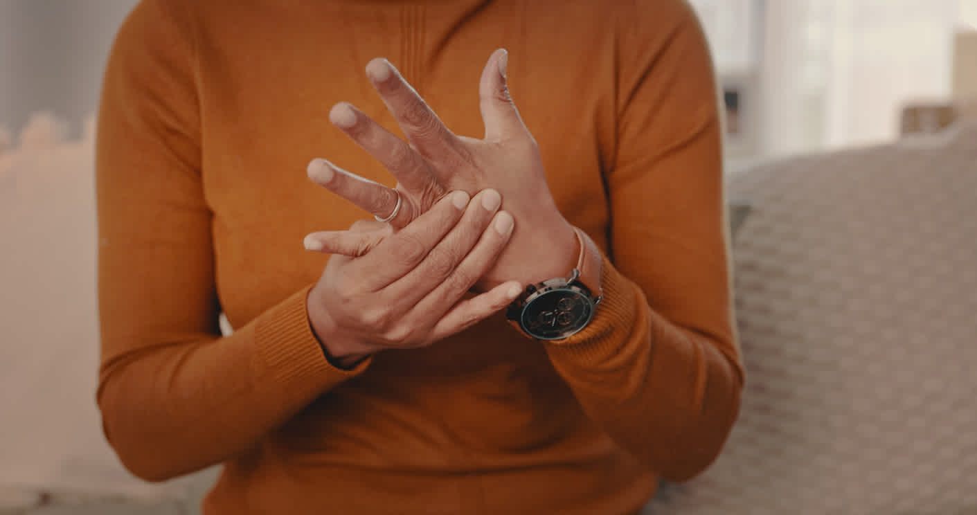person-touching-her-hands-worried