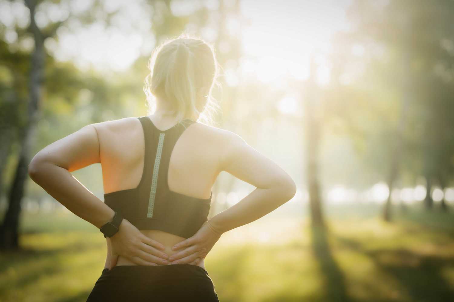 Runner woman with lower back pain
