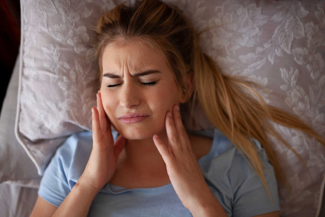 woman-feeling-tmj-pain