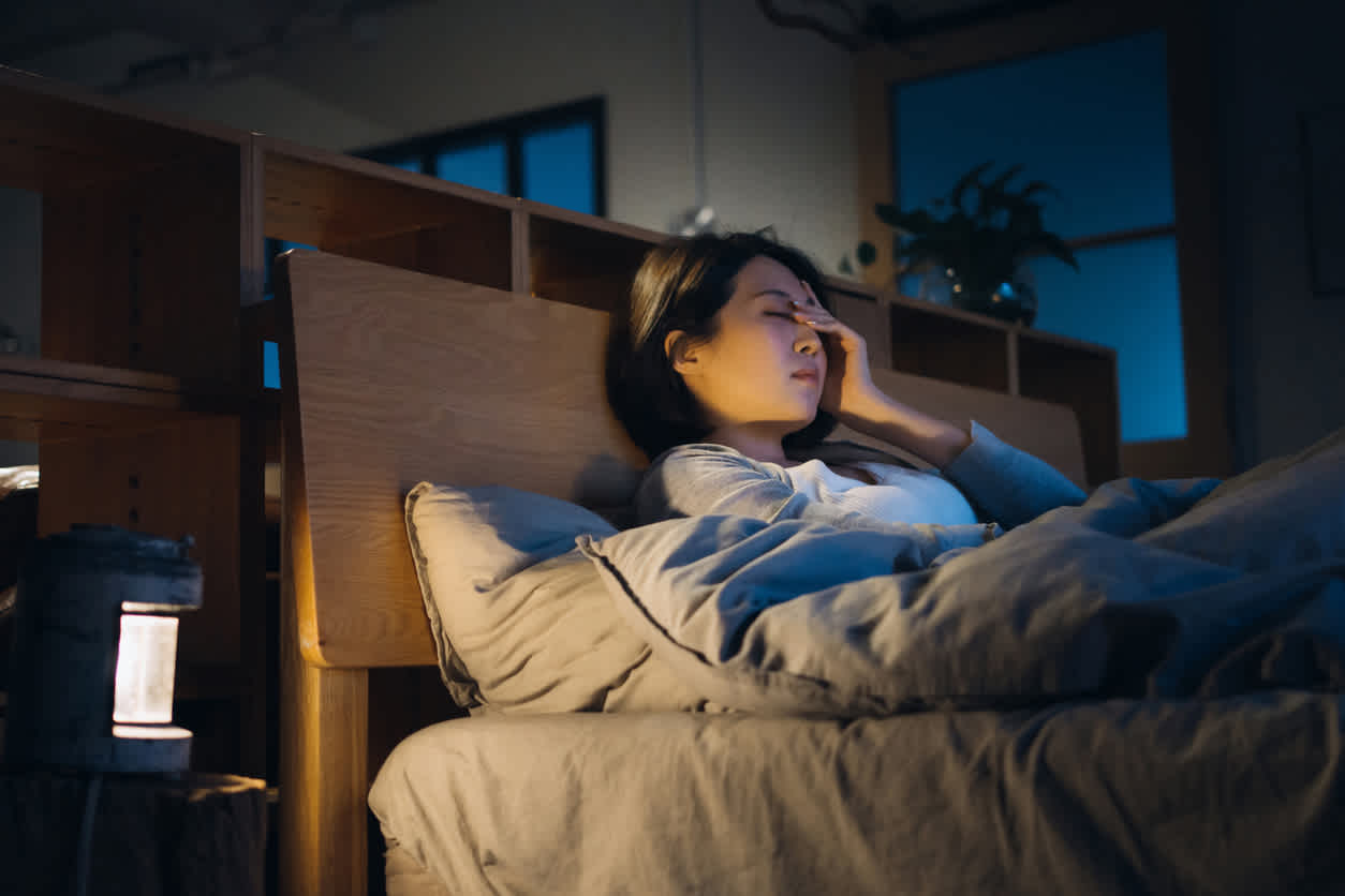 woman-in-bed-with-joint-pain