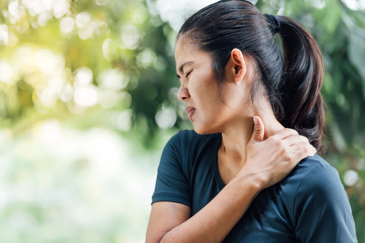 woman-in-nature-with-neck-pain