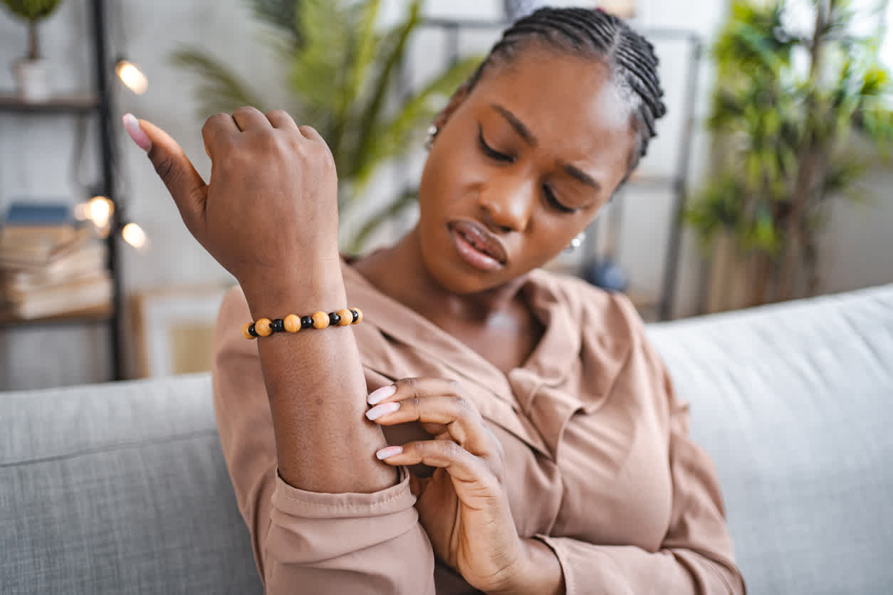 woman-looking-at-her-forearm-worried