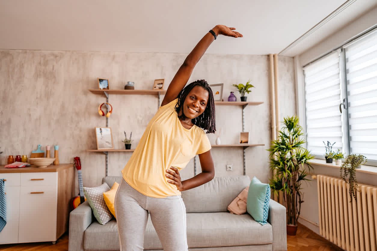 woman-stretching-in-her-living-room
