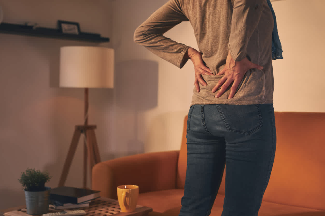 women-in-jeans-with-pain-in-her-back
