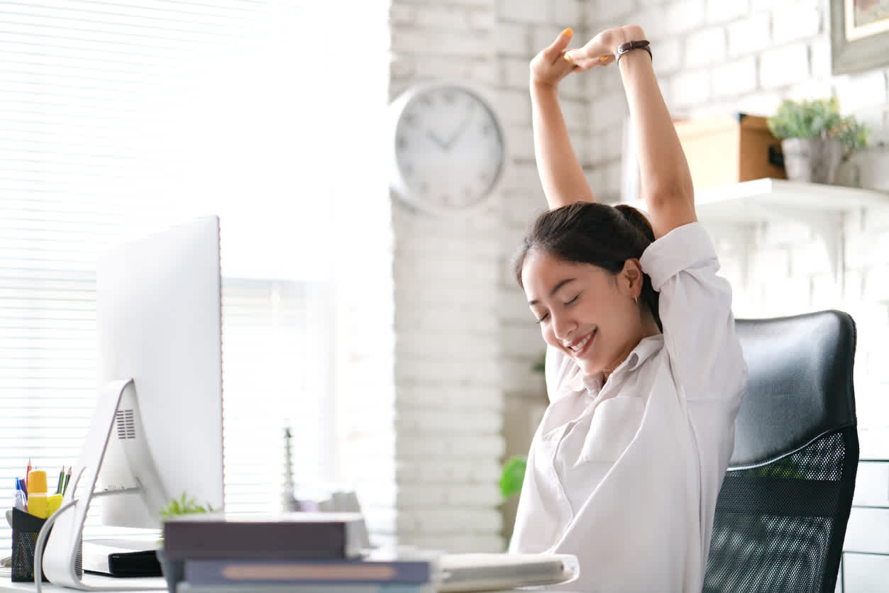 women-smiling-stretching-while-sitting