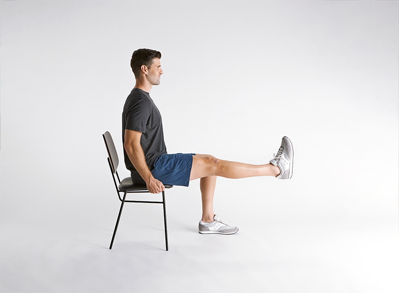 man-practicing-seated-leg-raise
