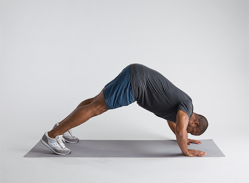 a-man-doing-pike-push-hold