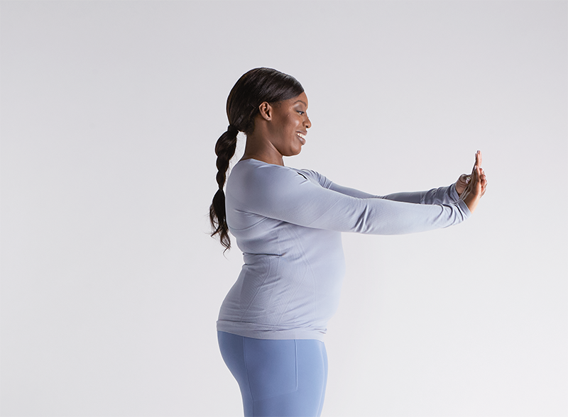 woman-standing-flexing-her-hands
